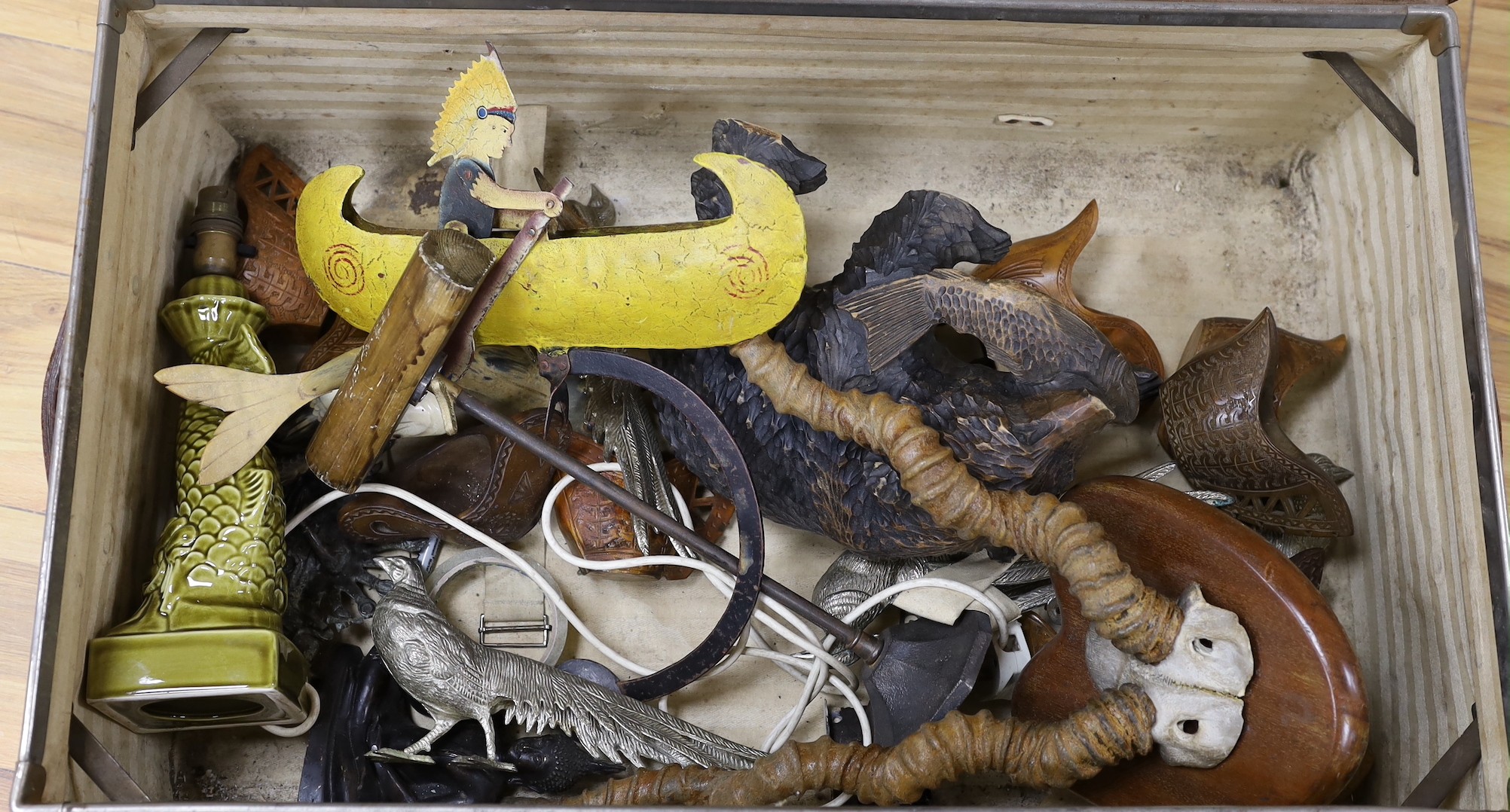 A trunk of various collectables including a Japanese carved wood bear, mounted antlers, other carvings etc.